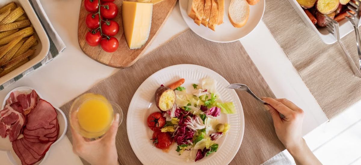 Top view of a delicious homemade meal with cheese, salad, and assorted ingredients.